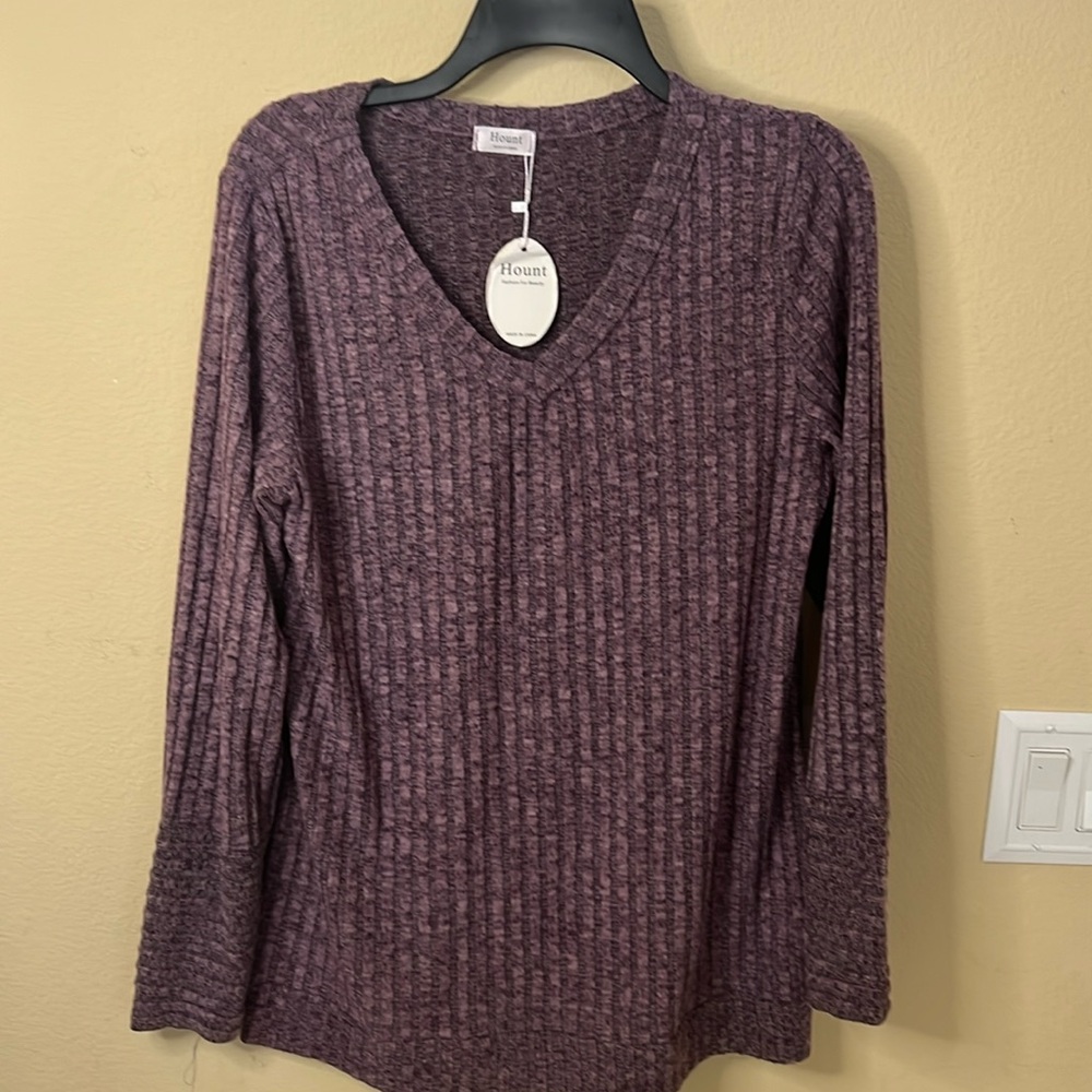 Purple v neck sweater. The size is medium.